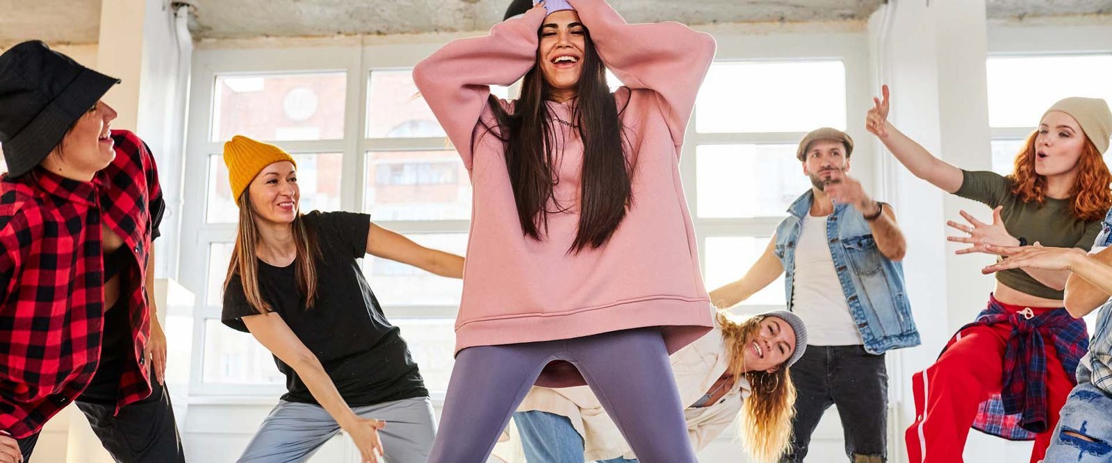 Woman,Learning,Hip-hop,Choreography,With,Her,Groupmates,In,Dance,Studio,